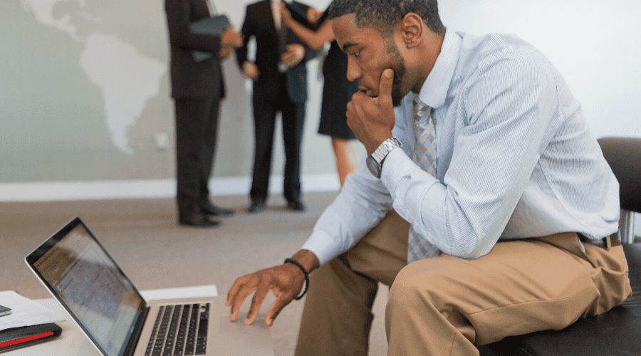 Concept photo of a man looking intently at a computer.
