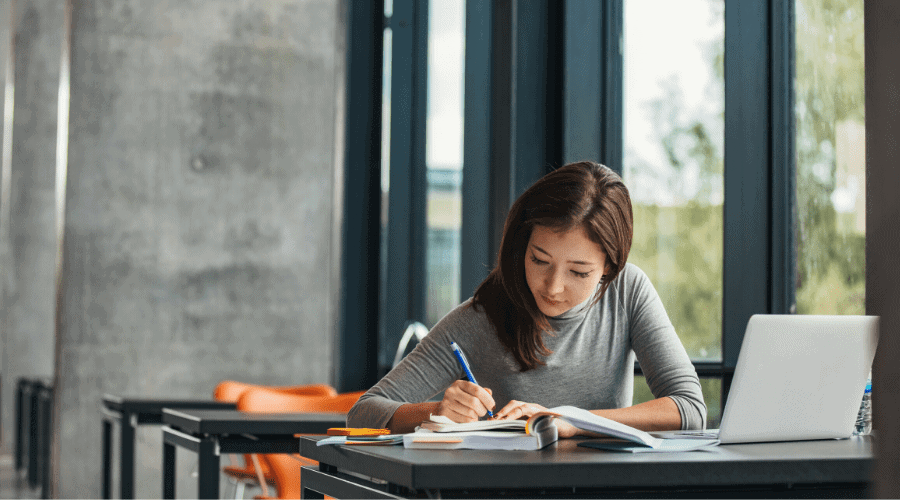 Concept photo of a woman studying by herself.