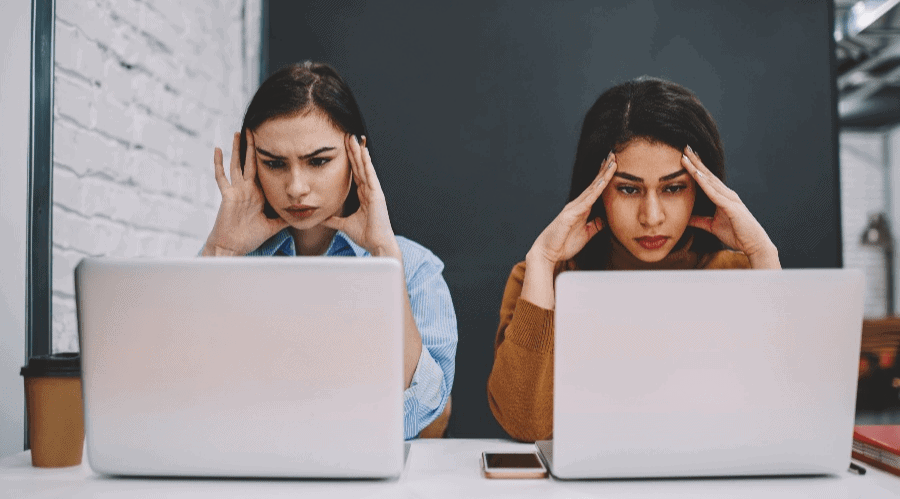 Two women at laptops