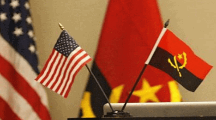 Photo of small US and Angola flags.