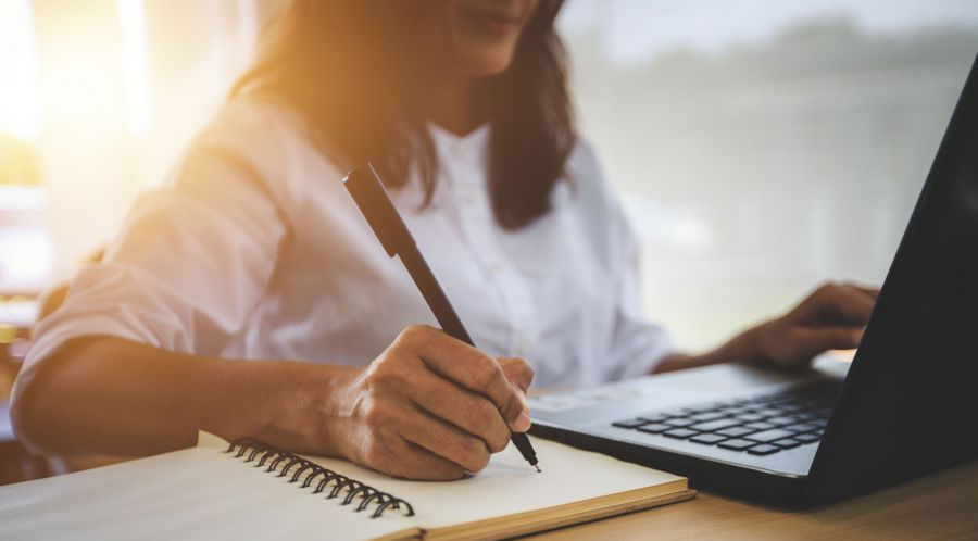 Concept photo of a woman studying at the computer.
