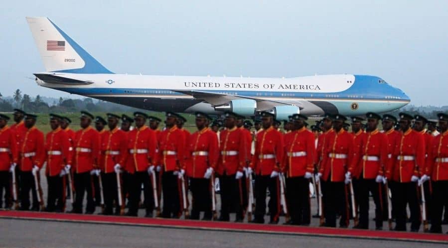 Tanzanian military honor guard waiting on tarmac with Air Force One in background