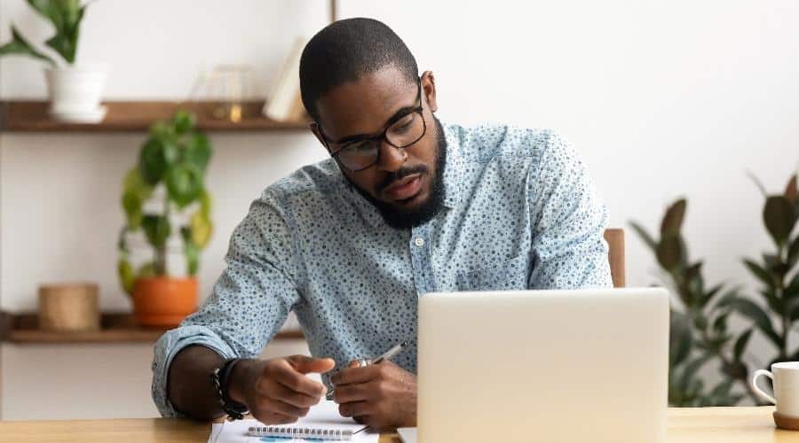Man studying at a computer.