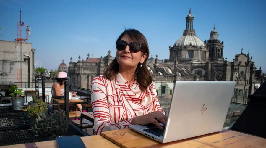 Female DTO working on a laptop on a rooftop in Paris